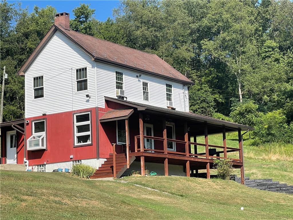 489 Jack Road Vandergrift, PA 15690 - Photo 1 of 47 a view of a house with a yard and sitting area