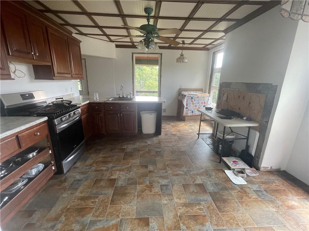 489 Jack Road Vandergrift, PA 15690 - Photo 17 of 47 a kitchen with a sink a stove and a refrigerator