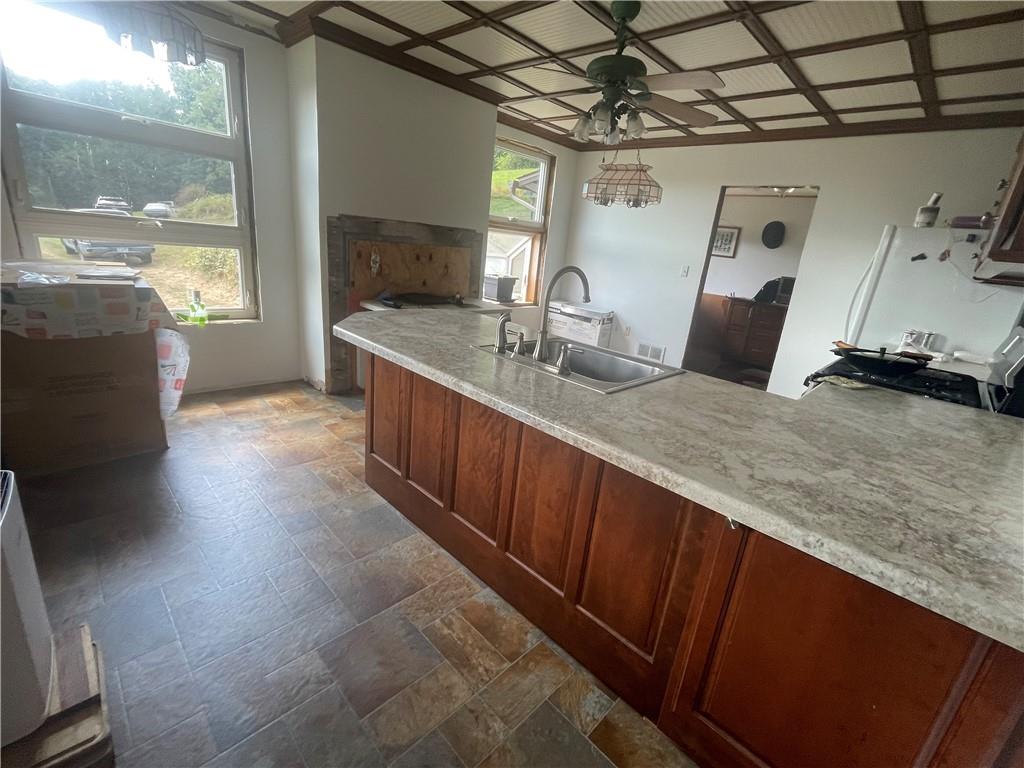 489 Jack Road Vandergrift, PA 15690 - Photo 21 of 47 a kitchen with granite countertop a sink and a stove