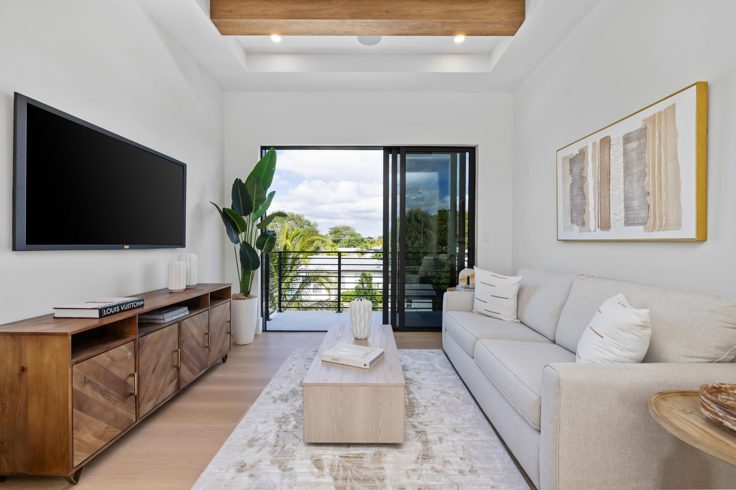 101 Northwest 17th Street Delray Beach, FL 33444 - Photo 20 of 46 a living room with furniture and a flat screen tv