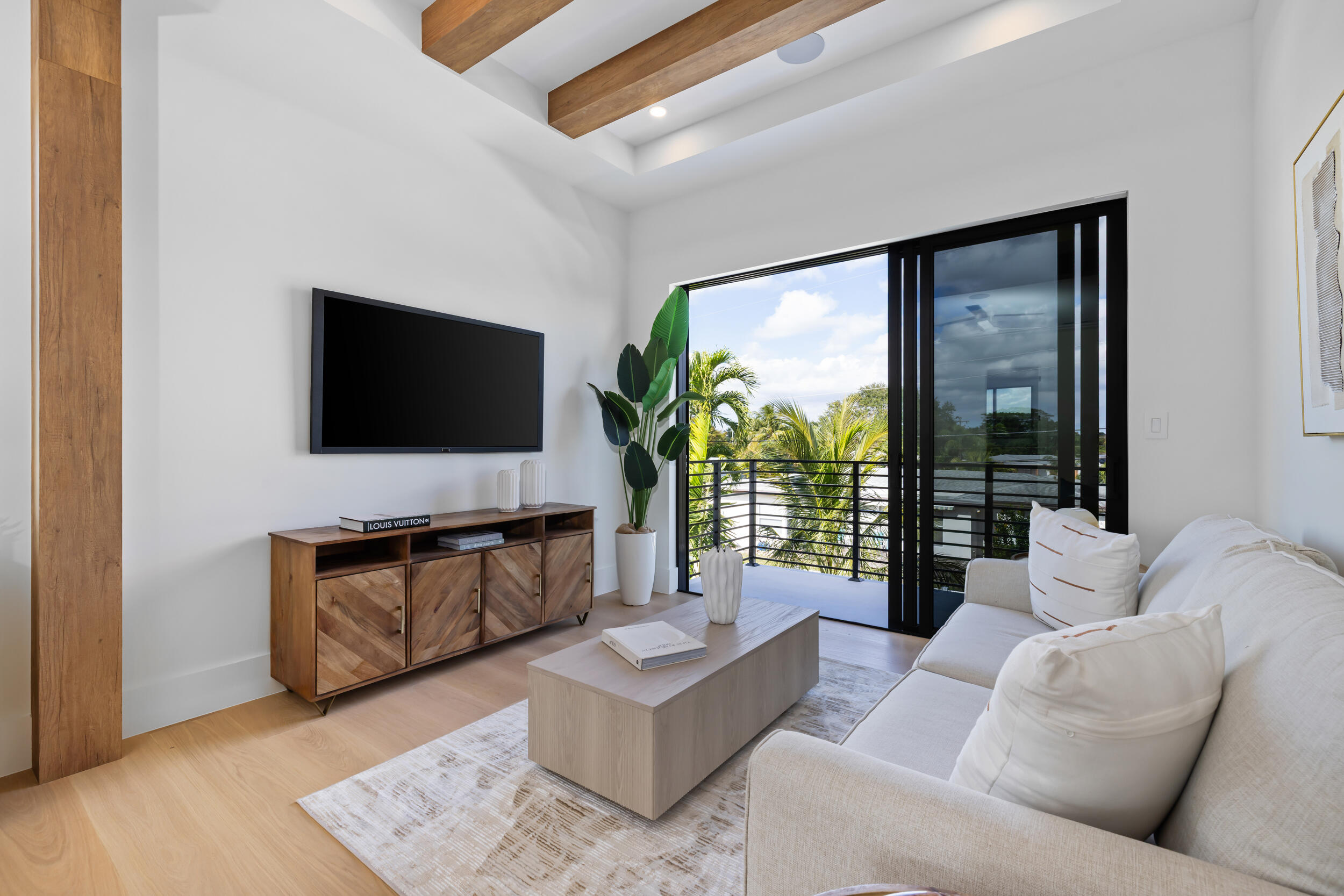 101 Northwest 17th Street Delray Beach, FL 33444 - Photo 21 of 46 a living room with furniture and a flat screen tv
