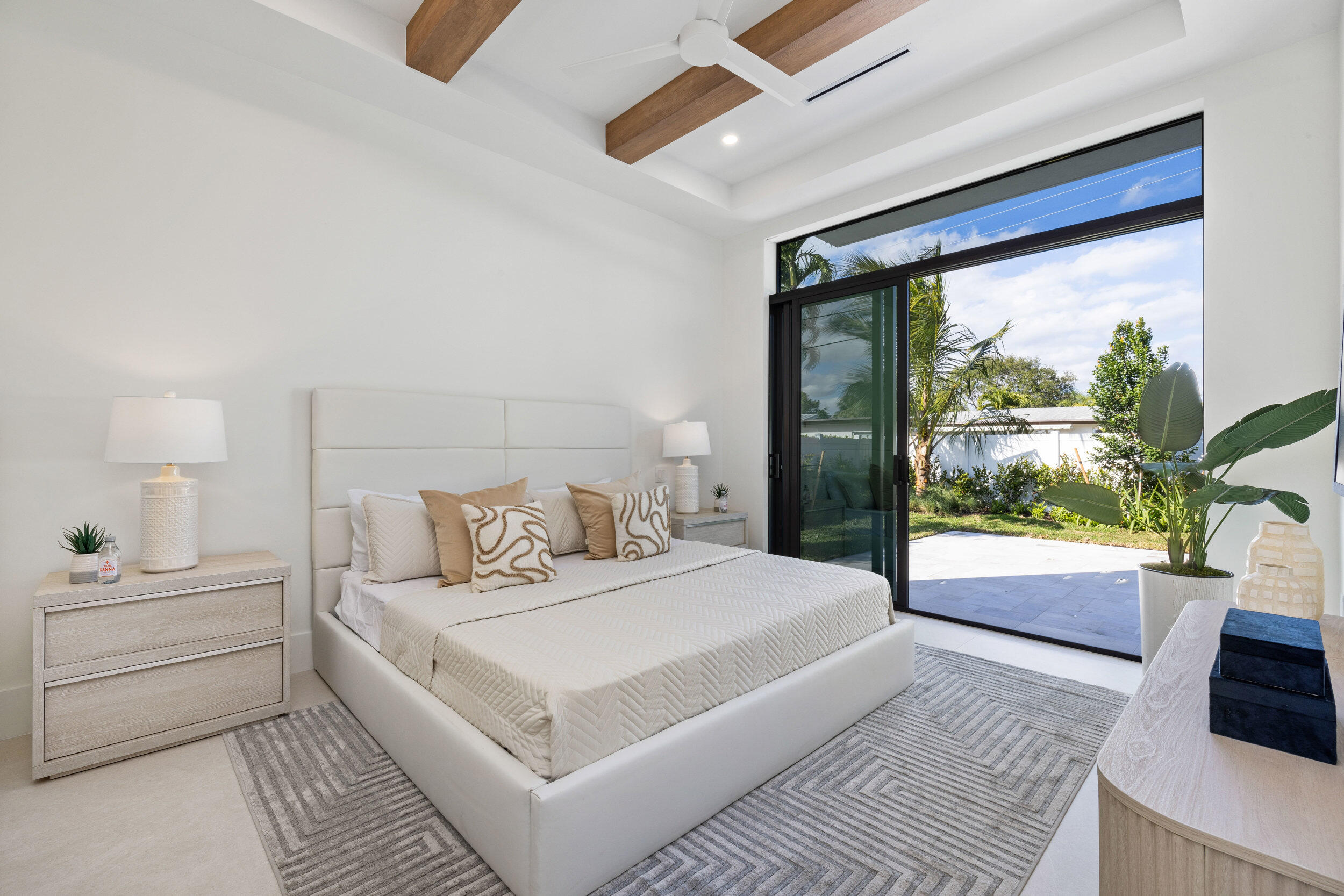 101 Northwest 17th Street Delray Beach, FL 33444 - Photo 26 of 46 a bedroom with a large bed and a large window