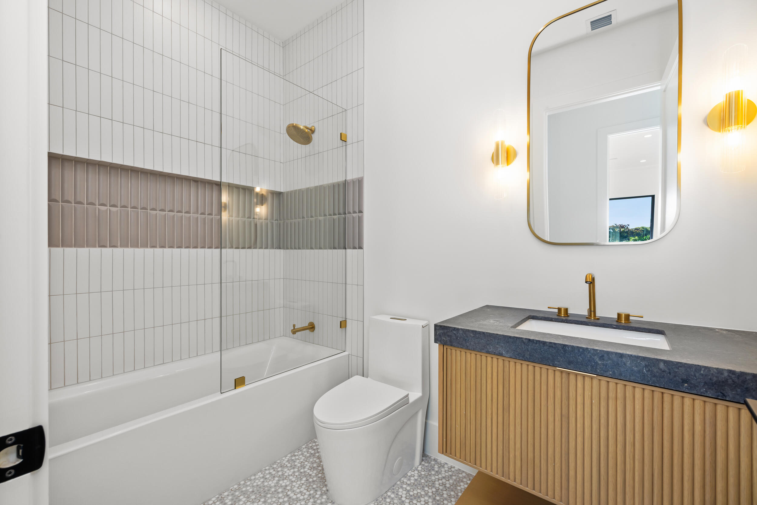 101 Northwest 17th Street Delray Beach, FL 33444 - Photo 34 of 46 a bathroom with a sink a toilet and shower