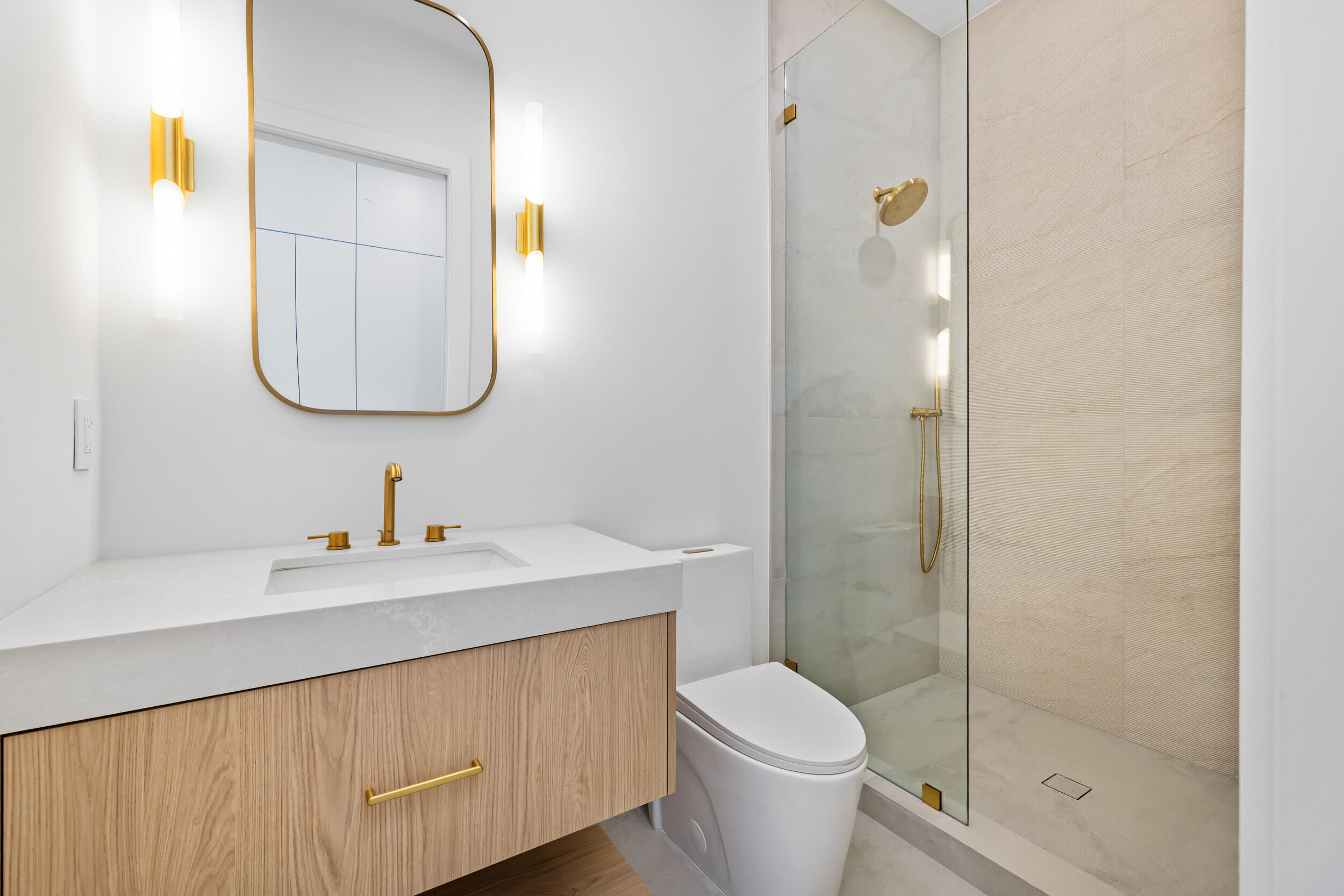 101 Northwest 17th Street Delray Beach, FL 33444 - Photo 37 of 46 a bathroom with a sink a toilet and shower