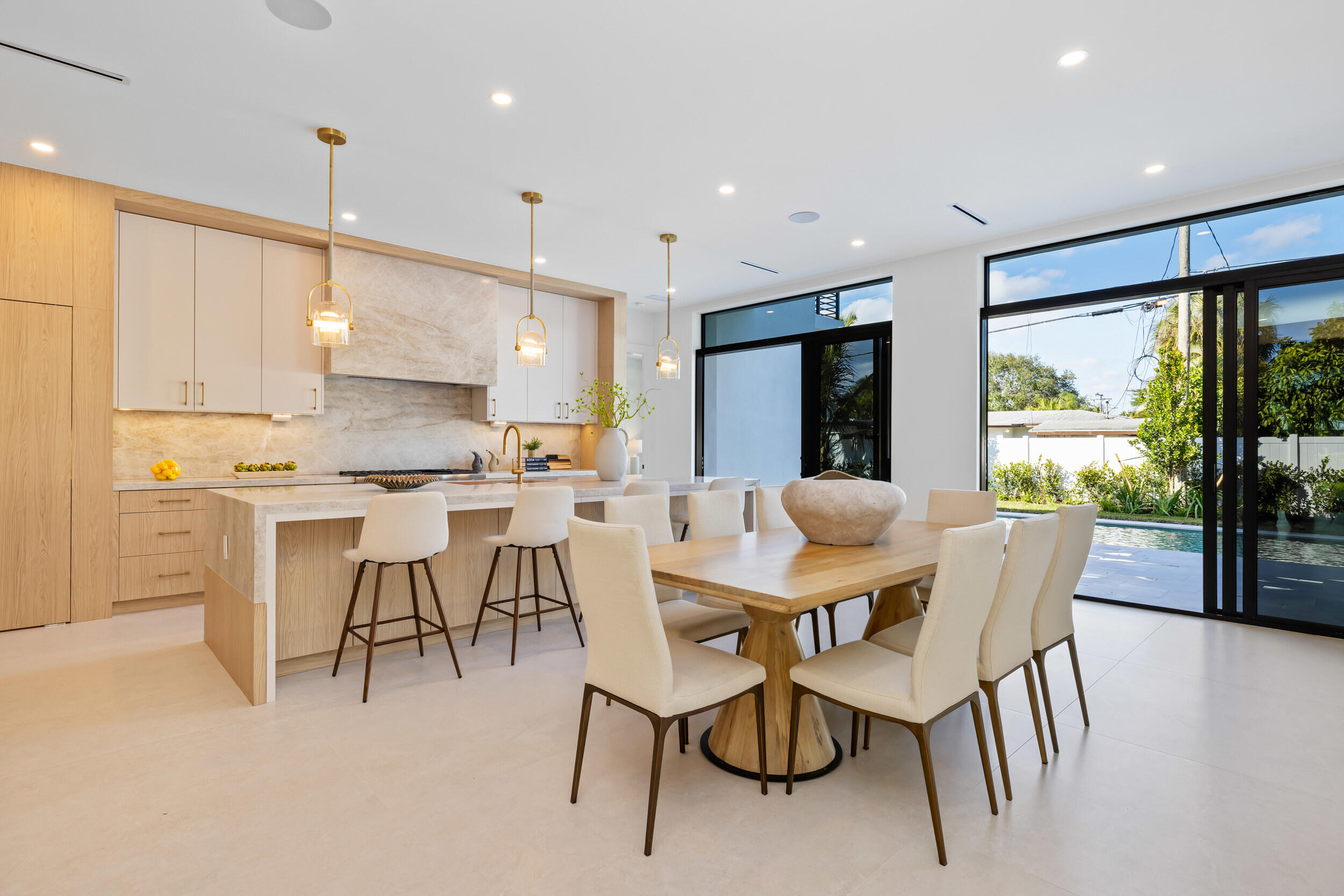 101 Northwest 17th Street Delray Beach, FL 33444 - Photo 8 of 46 a view of kitchen with kitchen island dining table and chairs