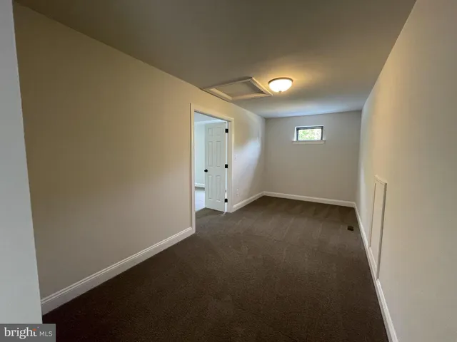 wooden floor and window in an empty room