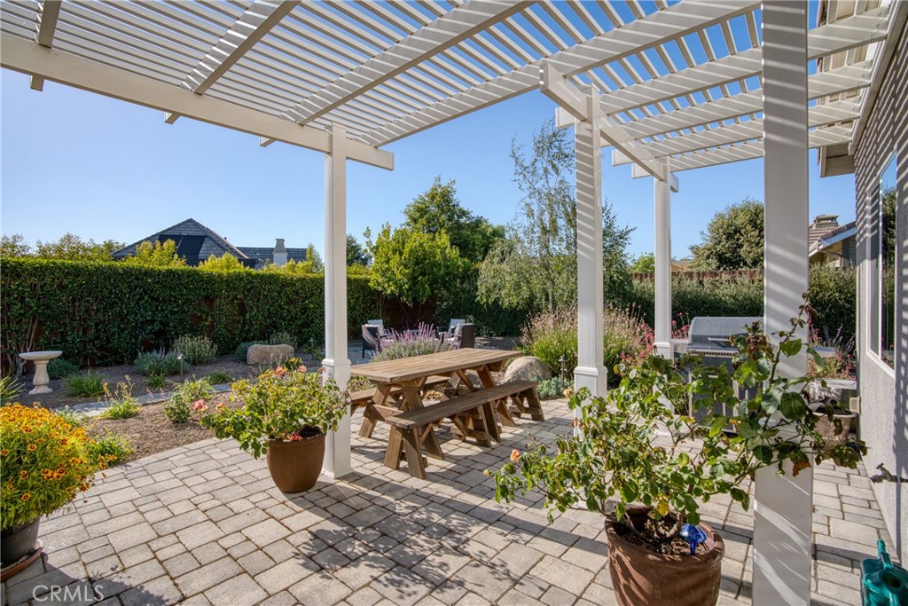 585 Valley Oak Road Solvang, CA 93463 - Photo 11 of 36 a view of a patio with table and chairs potted plants