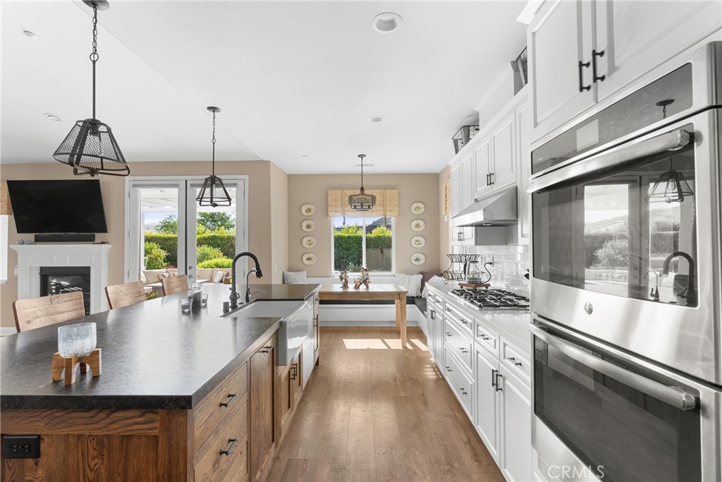 585 Valley Oak Road Solvang, CA 93463 - Photo 14 of 36 a large kitchen with kitchen island a large window in it