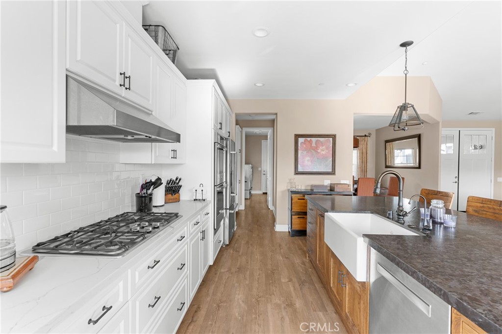 585 Valley Oak Road Solvang, CA 93463 - Photo 16 of 36 a kitchen with stainless steel appliances granite countertop a sink stove and refrigerator