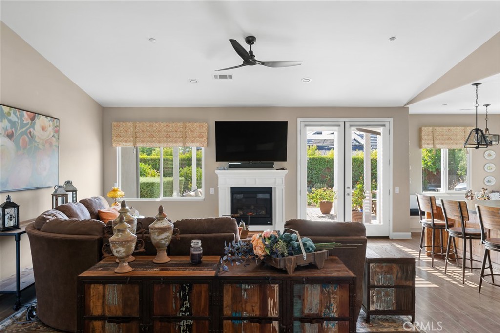 585 Valley Oak Road Solvang, CA 93463 - Photo 20 of 36 a living room with furniture fireplace and a large window