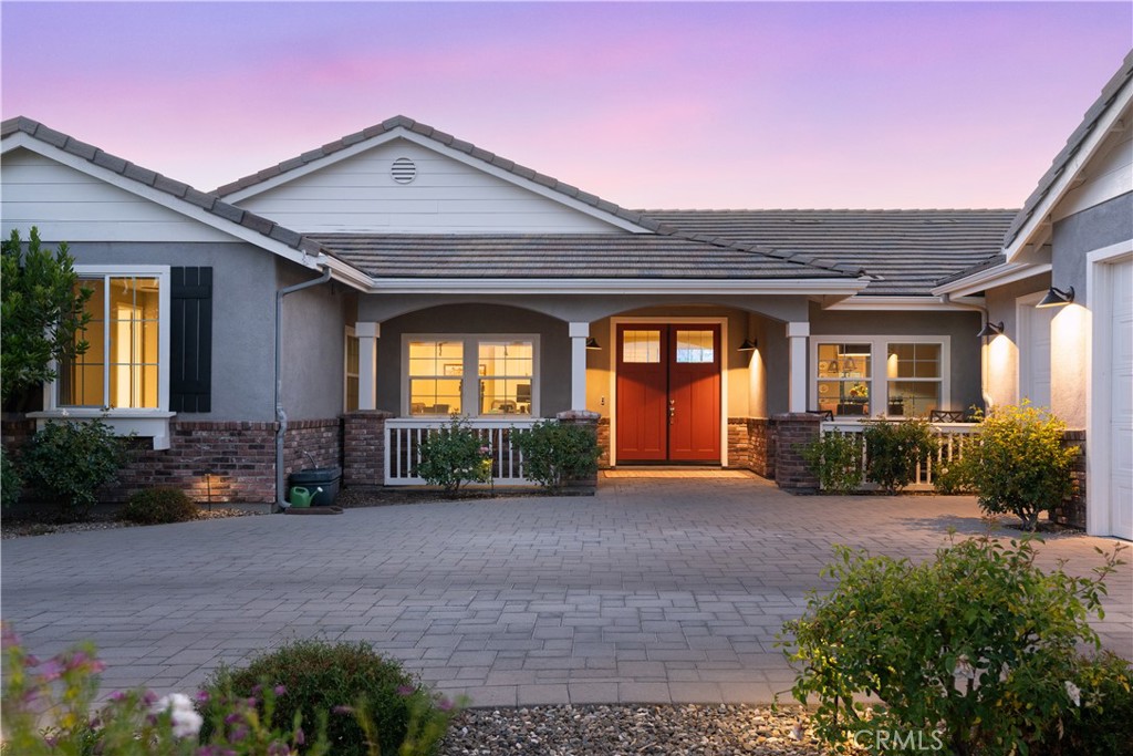 585 Valley Oak Road Solvang, CA 93463 - Photo 2 of 36 a front view of a house with garden