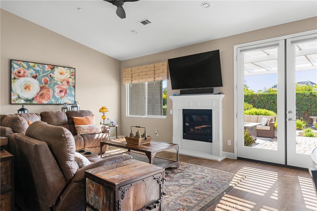 585 Valley Oak Road Solvang, CA 93463 - Photo 24 of 36 a living room with furniture a flat screen tv and a fireplace