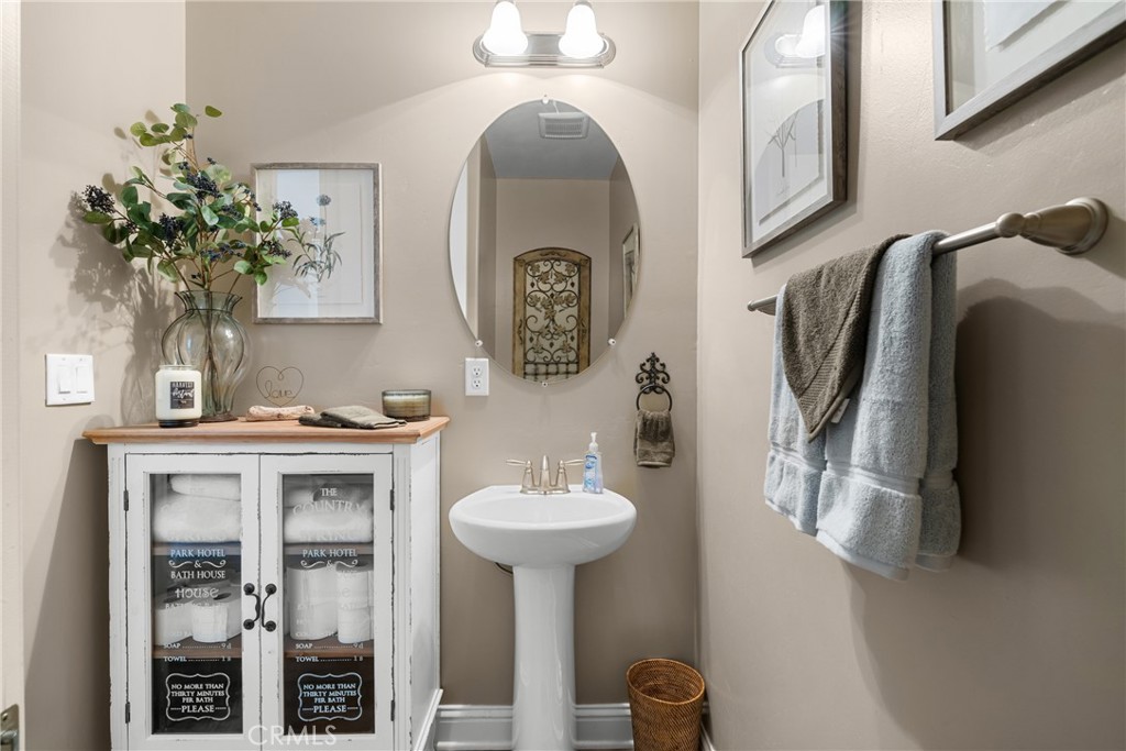 585 Valley Oak Road Solvang, CA 93463 - Photo 30 of 36 a bathroom with a sink and a mirror