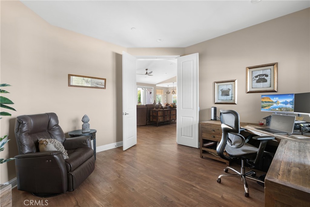 585 Valley Oak Road Solvang, CA 93463 - Photo 34 of 36 a livingroom with workspace and a couch