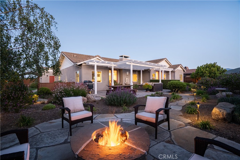 585 Valley Oak Road Solvang, CA 93463 - Photo 4 of 36 a view of a house with swimming pool and sitting area