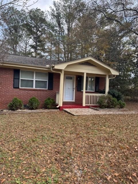 3741 Hopkins Road, Unit A Powder Springs, GA 30127 - Photo 2 of 25 a front view of a house with yard and tress