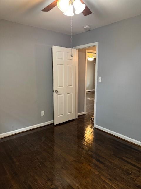 3741 Hopkins Road, Unit A Powder Springs, GA 30127 - Photo 22 of 25 a view of an empty room with wooden floor and a ceiling fan