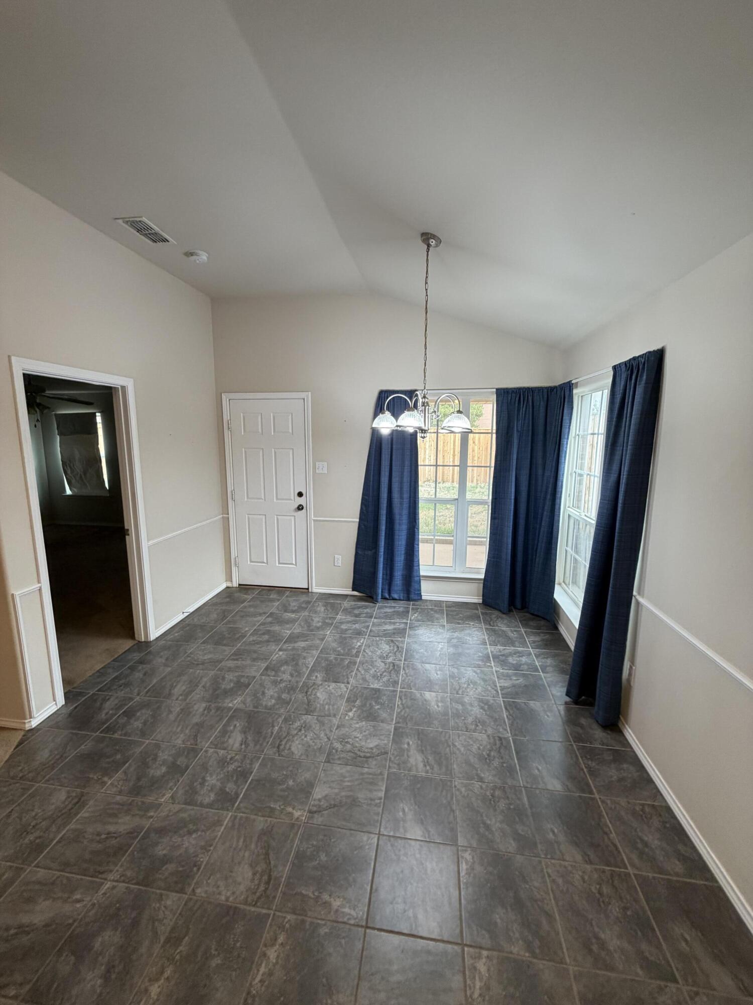 6544 84th Street Lubbock, TX 79424 - Photo 19 of 29 a big room with closet and entryway