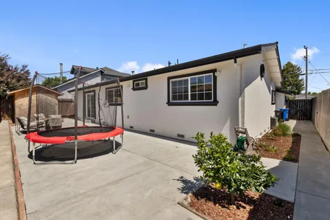 a front view of a house with an outdoor seating