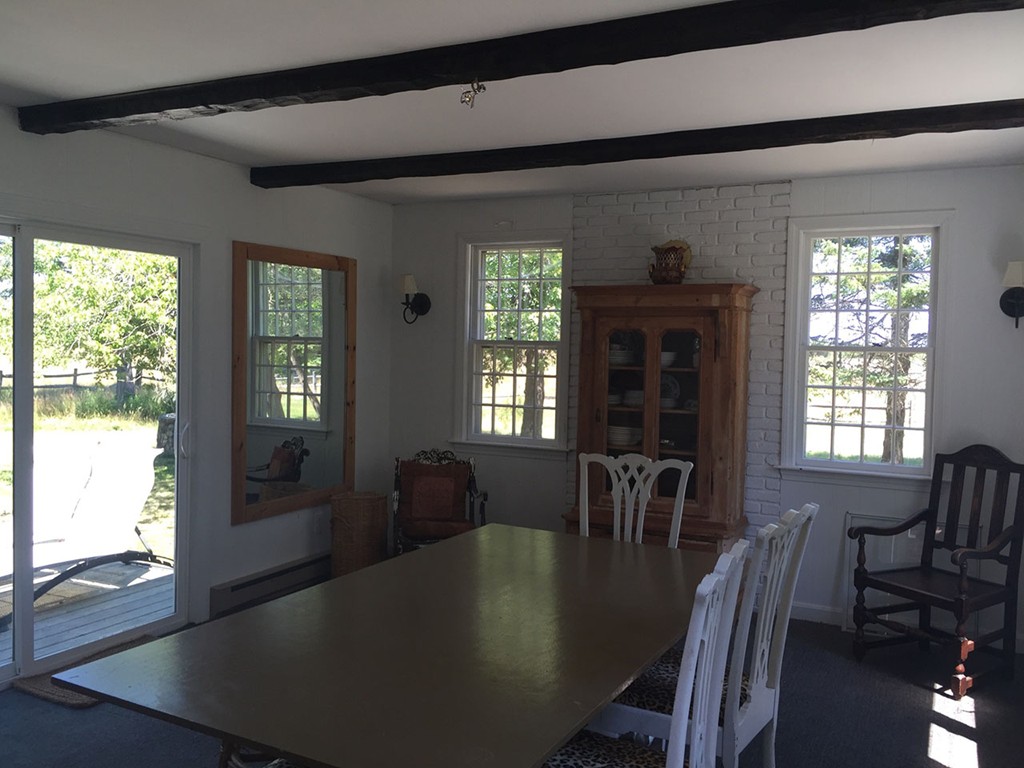 6 Chebacco Road Ipswich, MA 01938 - Photo 6 of 11 a view of a dining room with furniture window and outside view