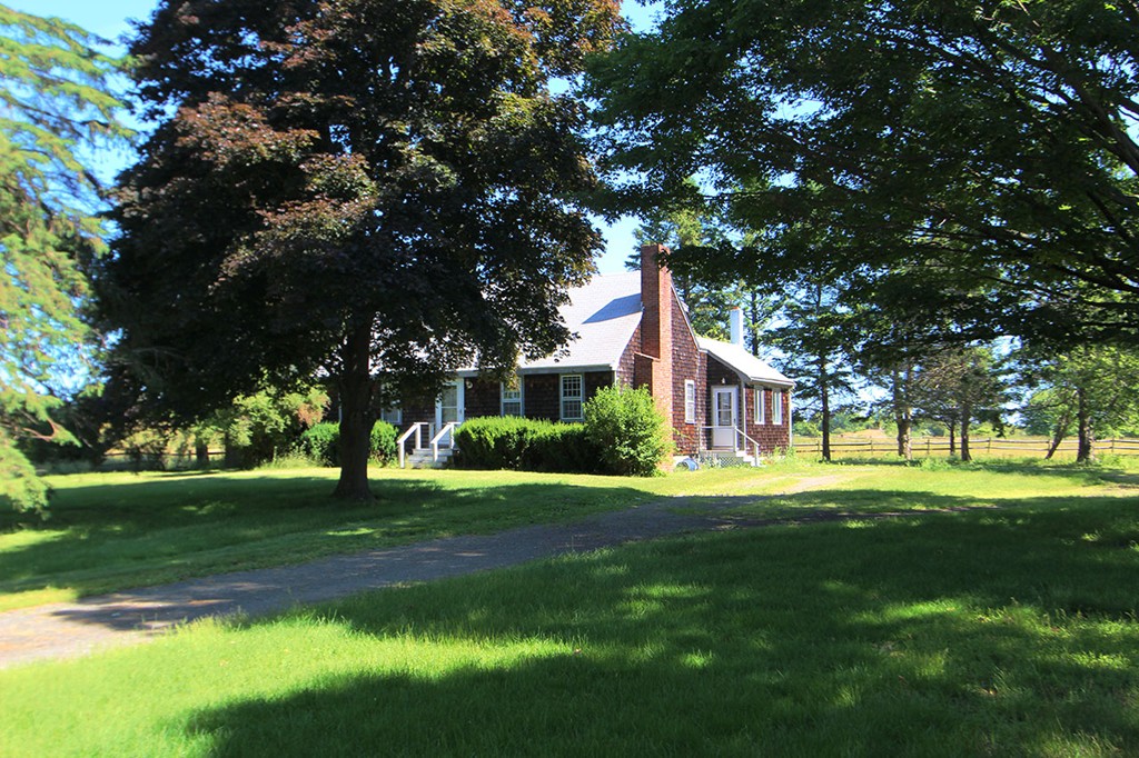 6 Chebacco Road Ipswich, MA 01938 - Photo 10 of 11 a front view of a house with a yard