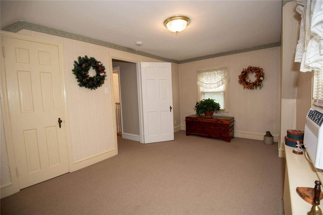 706 Stones Crossing Road Easton, PA 18045 - Photo 23 of 40 Another view of the cozy, well-lit interior space features plush carpeting and classic paneled doors.