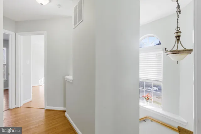 a view of an entryway with wooden floor