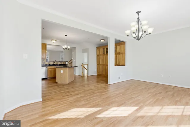 a view of a kitchen with a stove cabinets and wooden floor