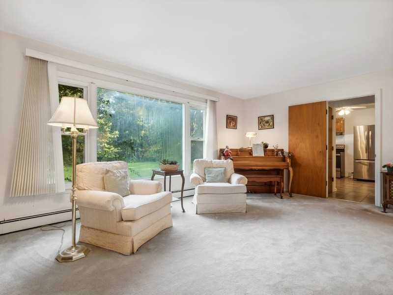 22 Brown Road East Fishkill, NY 12590 - Photo 12 of 37 a living room with furniture and a large window