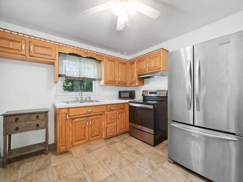 22 Brown Road East Fishkill, NY 12590 - Photo 16 of 37 a kitchen with stainless steel appliances granite countertop a refrigerator sink and cabinets