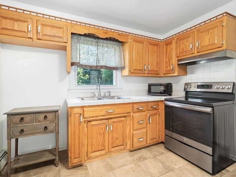 22 Brown Road East Fishkill, NY 12590 - Photo 17 of 37 a kitchen with stainless steel appliances granite countertop a sink stove and cabinets