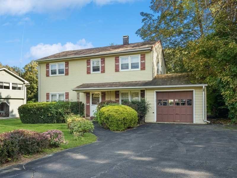 22 Brown Road East Fishkill, NY 12590 - Photo 3 of 37 a front view of a house with a yard and garage