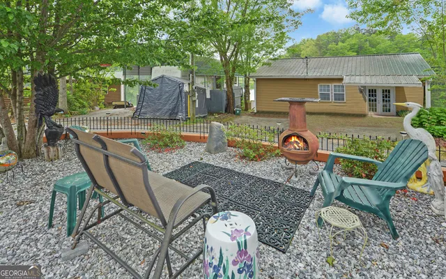 an outdoor sitting area with furniture