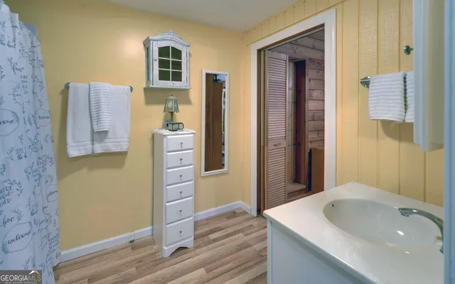 a living room with furniture a wooden floor and a table