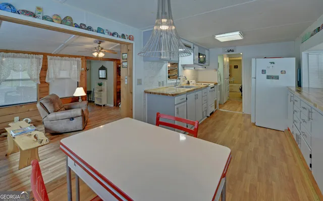 a room with wooden floor and window