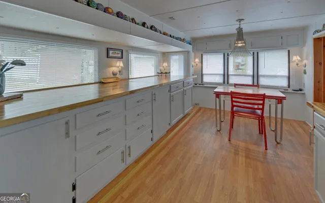 a kitchen with a stove a sink and a refrigerator