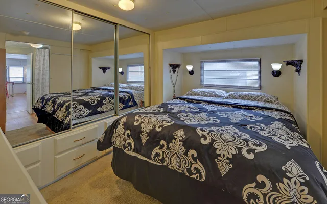 a view of a livingroom with furniture and staircase