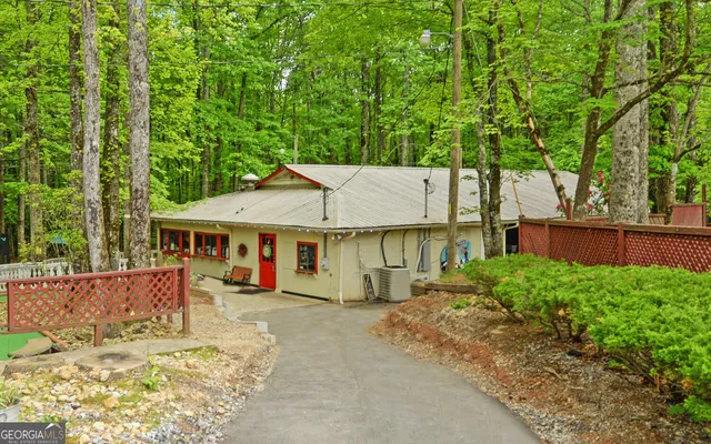 an aerial view of a house with a yard and garden