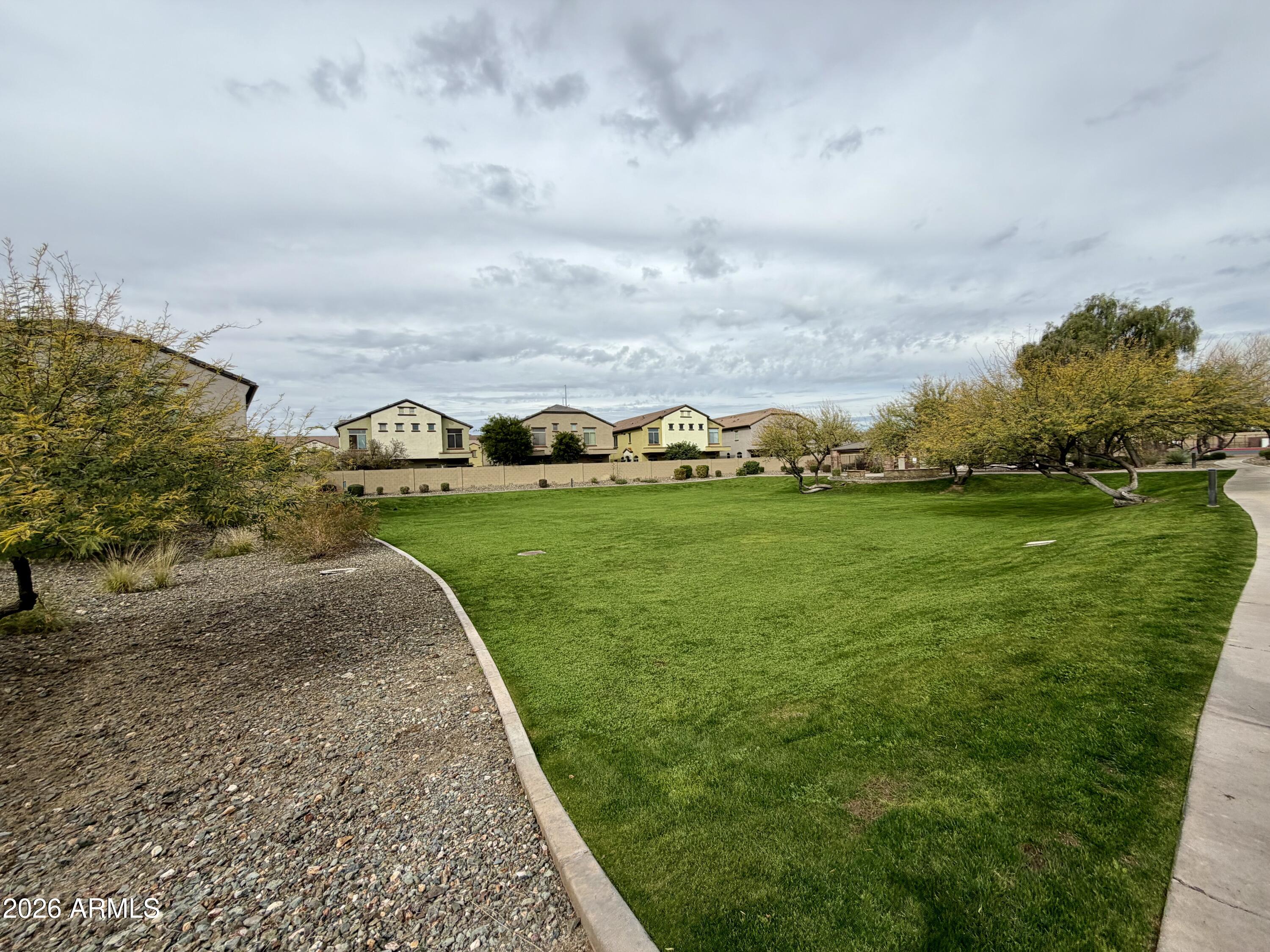 2725 East Mine Creek Road, Unit 2058 Phoenix, AZ 85024 - Photo 14 of 16 a view of a golf course with the garden