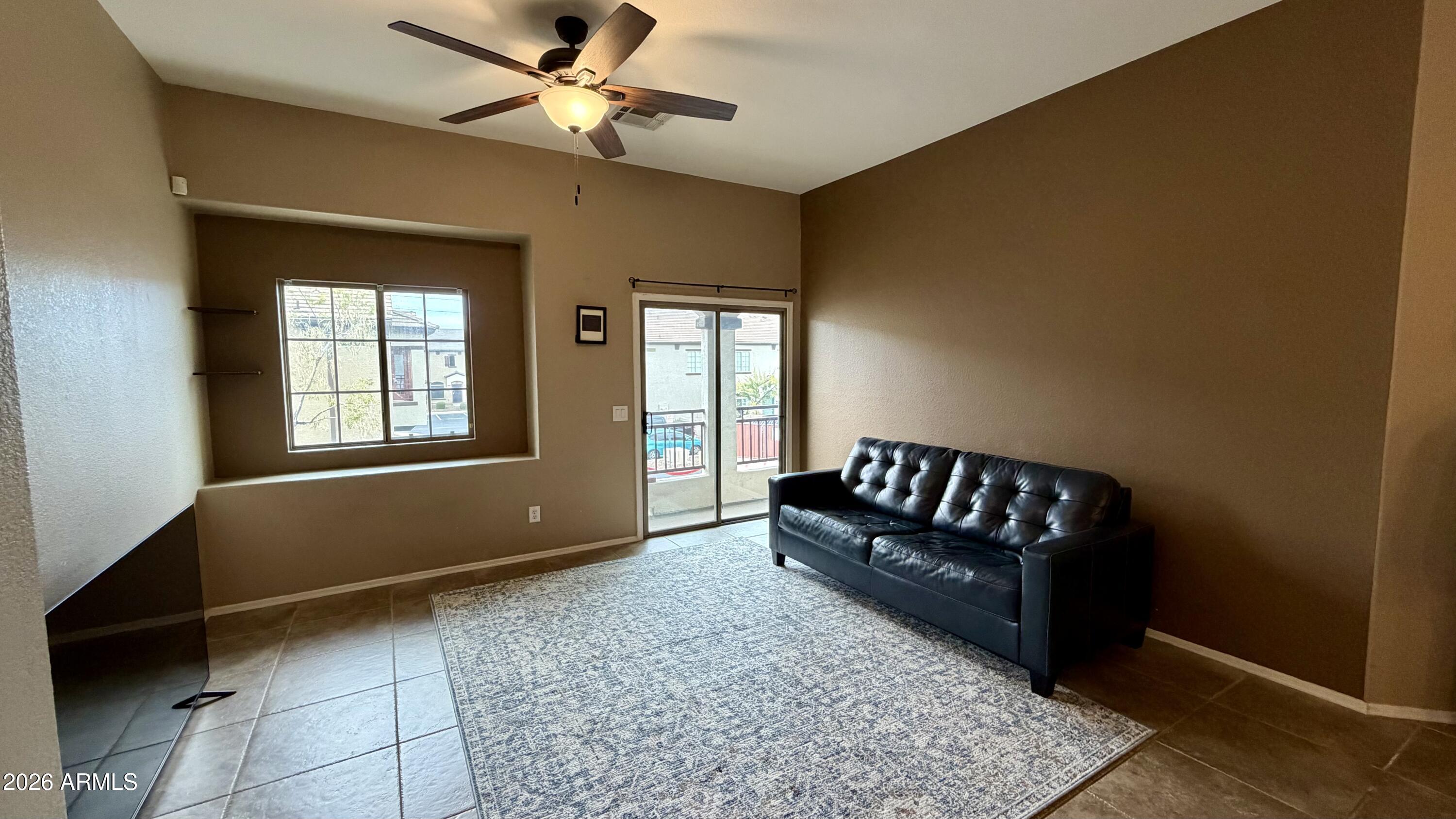 2725 East Mine Creek Road, Unit 2058 Phoenix, AZ 85024 - Photo 6 of 16 a living room with furniture and a window