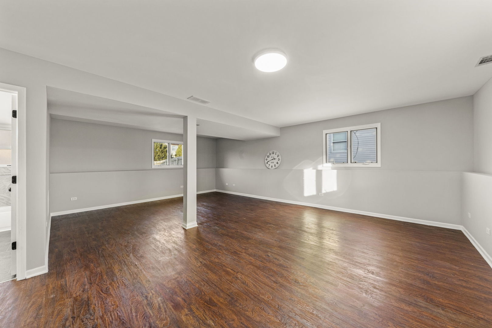 6605 Klinger Lane Plainfield, IL 60586 - Photo 15 of 21 a view of empty room with wooden floor and fireplace