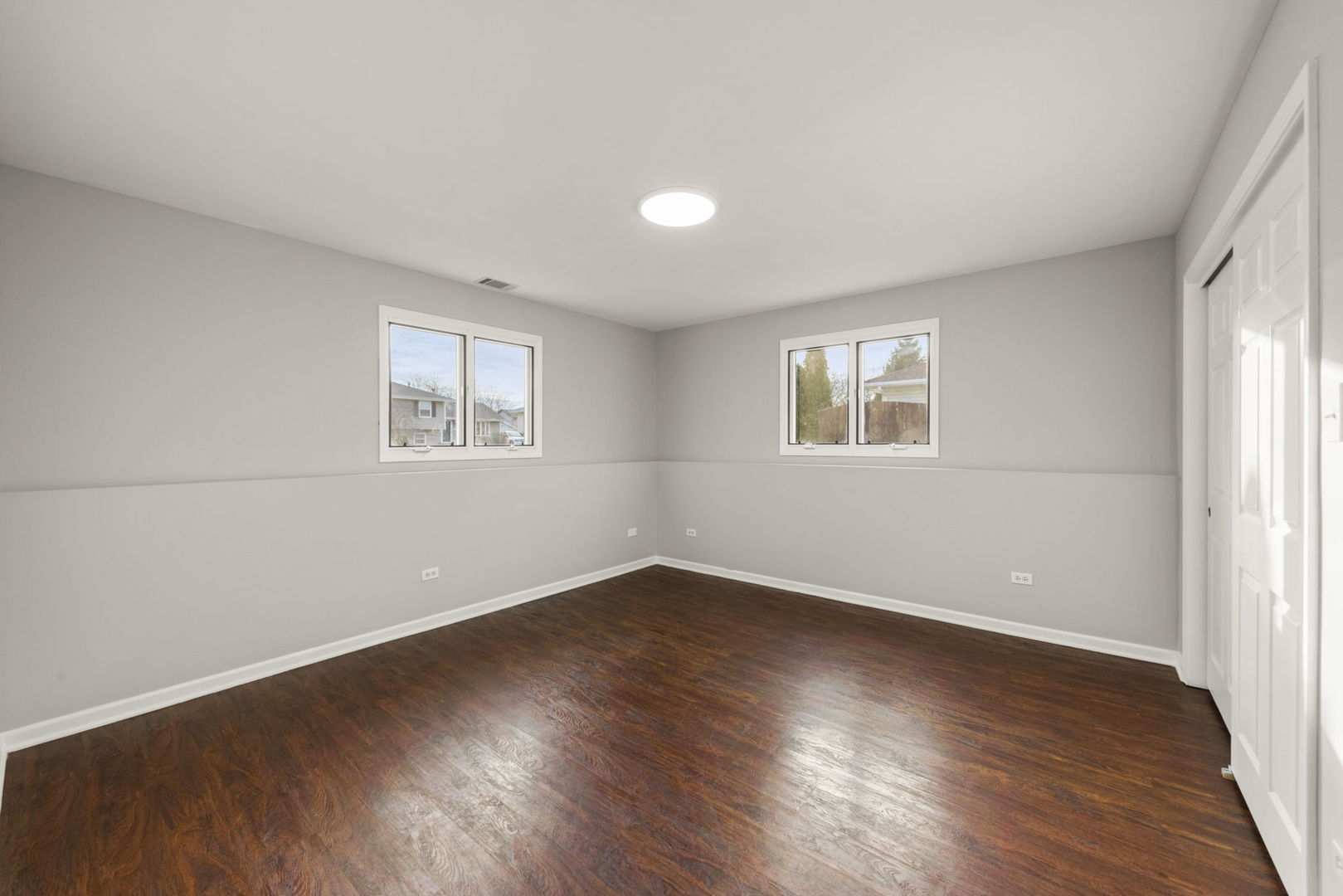 6605 Klinger Lane Plainfield, IL 60586 - Photo 17 of 21 an empty room with wooden floor and windows