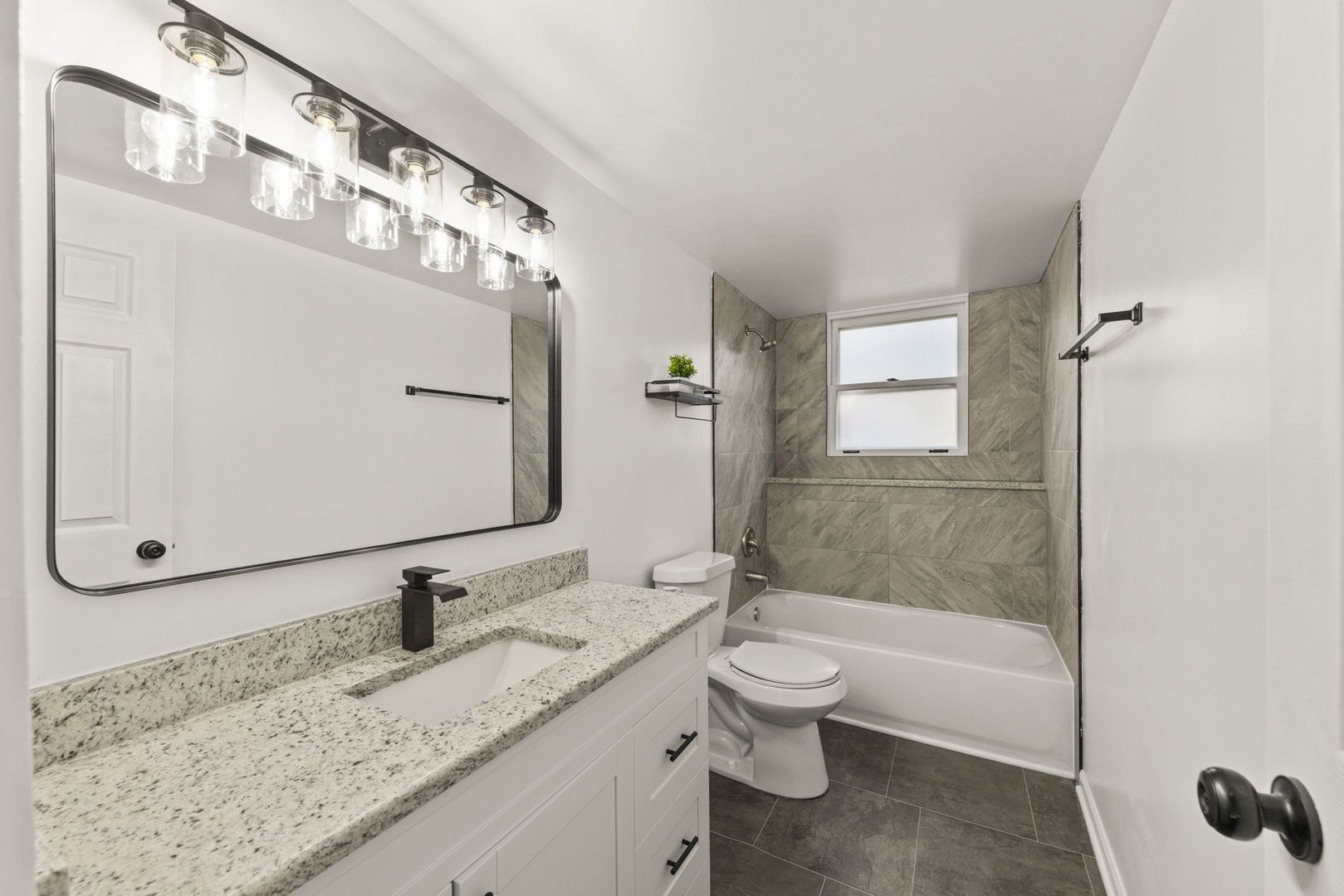 6605 Klinger Lane Plainfield, IL 60586 - Photo 18 of 21 a bathroom with a granite countertop sink a toilet and shower