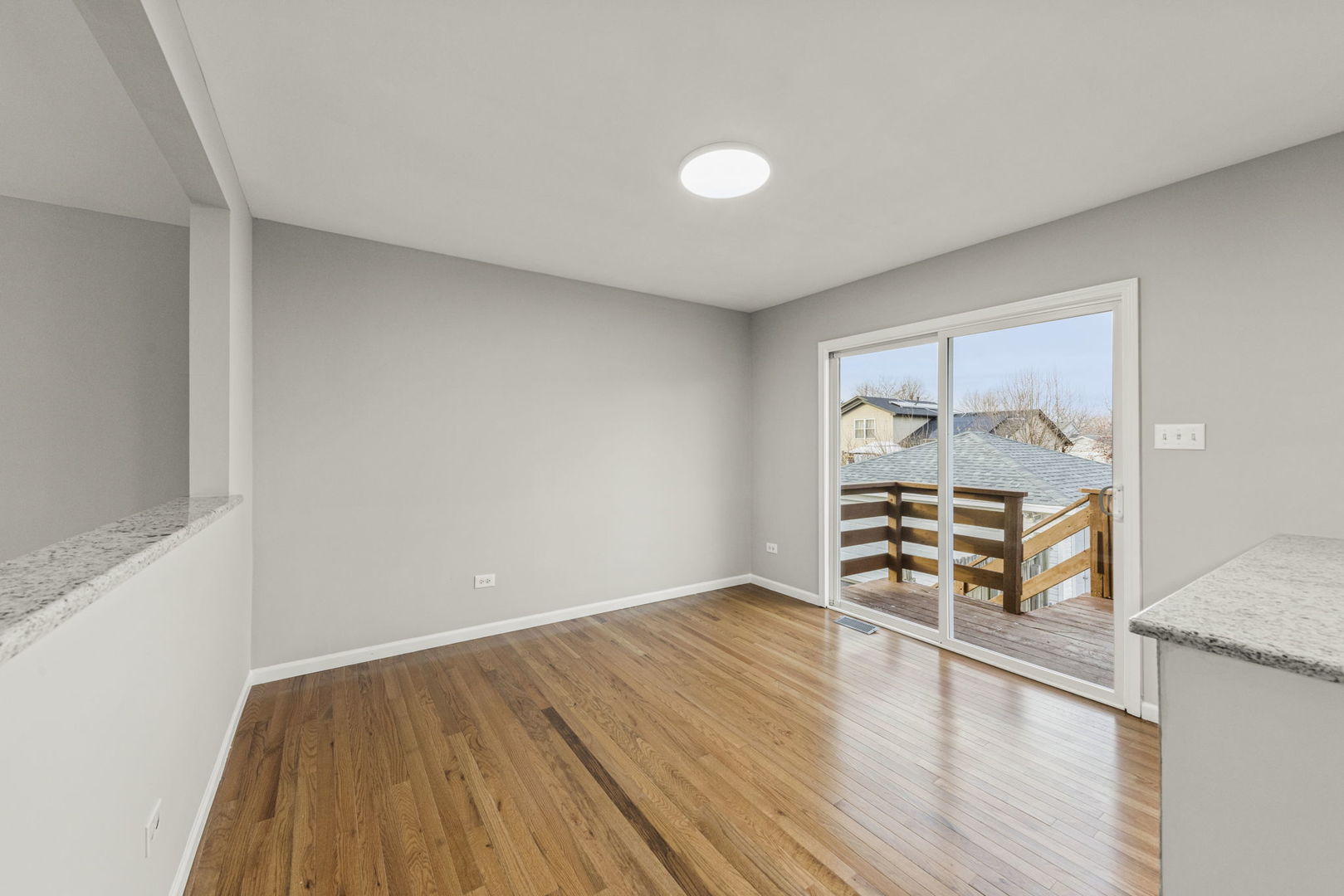 6605 Klinger Lane Plainfield, IL 60586 - Photo 7 of 21 a view of an empty room and wooden floor