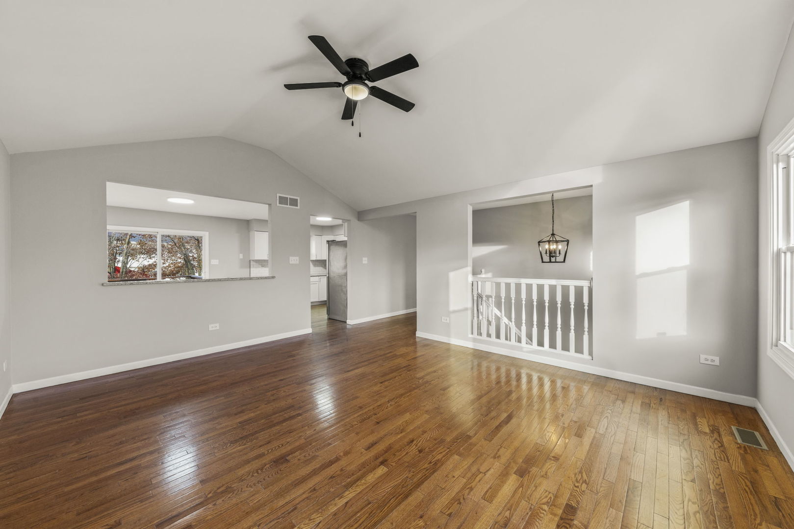 6605 Klinger Lane Plainfield, IL 60586 - Photo 9 of 21 a view of a room with wooden floor and ceiling fan