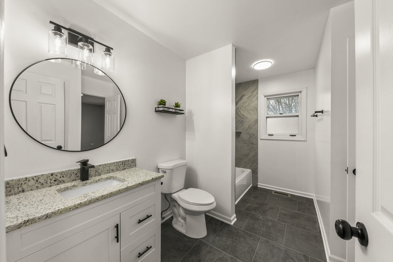 6605 Klinger Lane Plainfield, IL 60586 - Photo 10 of 21 a bathroom with a granite countertop toilet a sink and a mirror