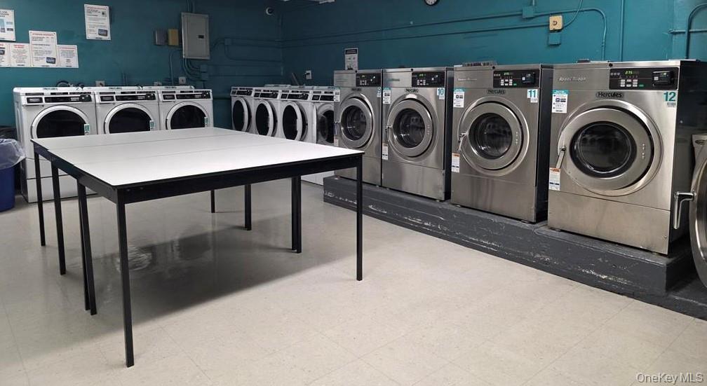 84-01 Main Street, Unit 207 Queens, NY 11435 - Photo 4 of 4 a utility room with dryer and washer