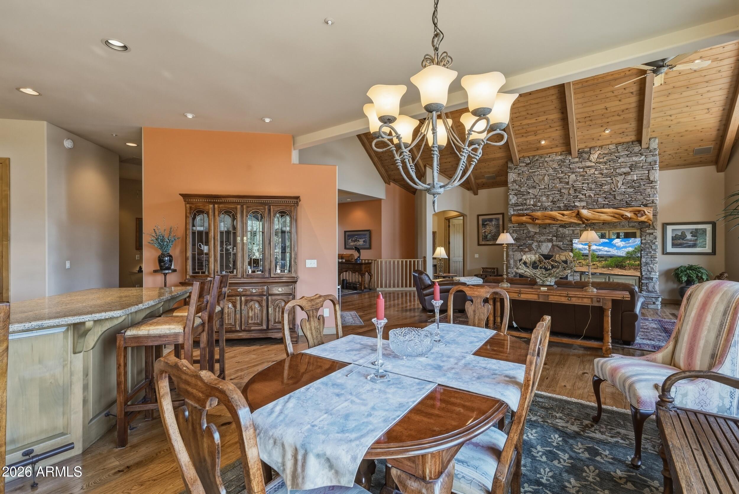 3101 East Mayfield Payson, AZ 85541 - Photo 13 of 71 a view of a dining room with furniture a chandelier and wooden floor