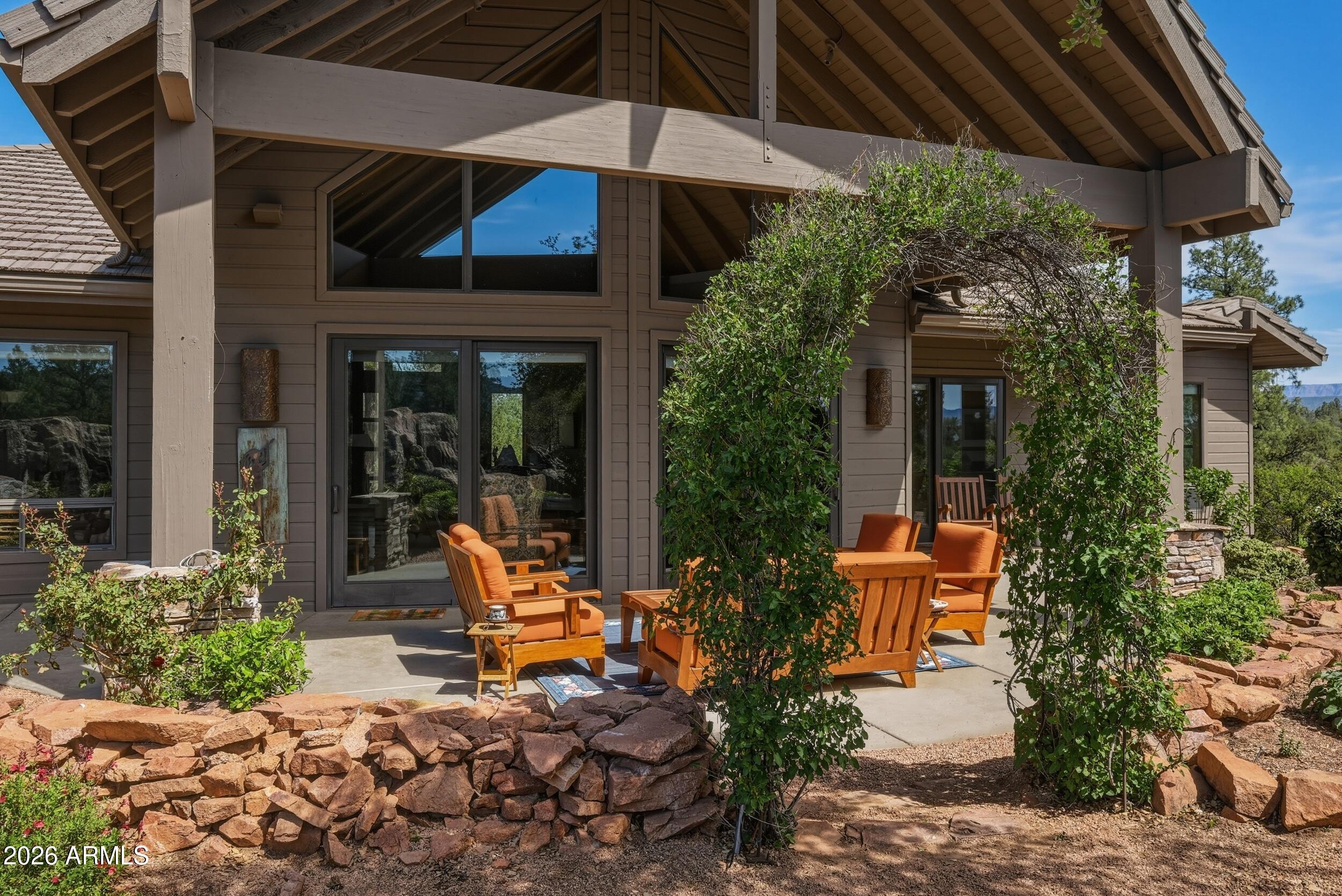 3101 East Mayfield Payson, AZ 85541 - Photo 21 of 71 a view of a patio with table and chairs under an umbrella