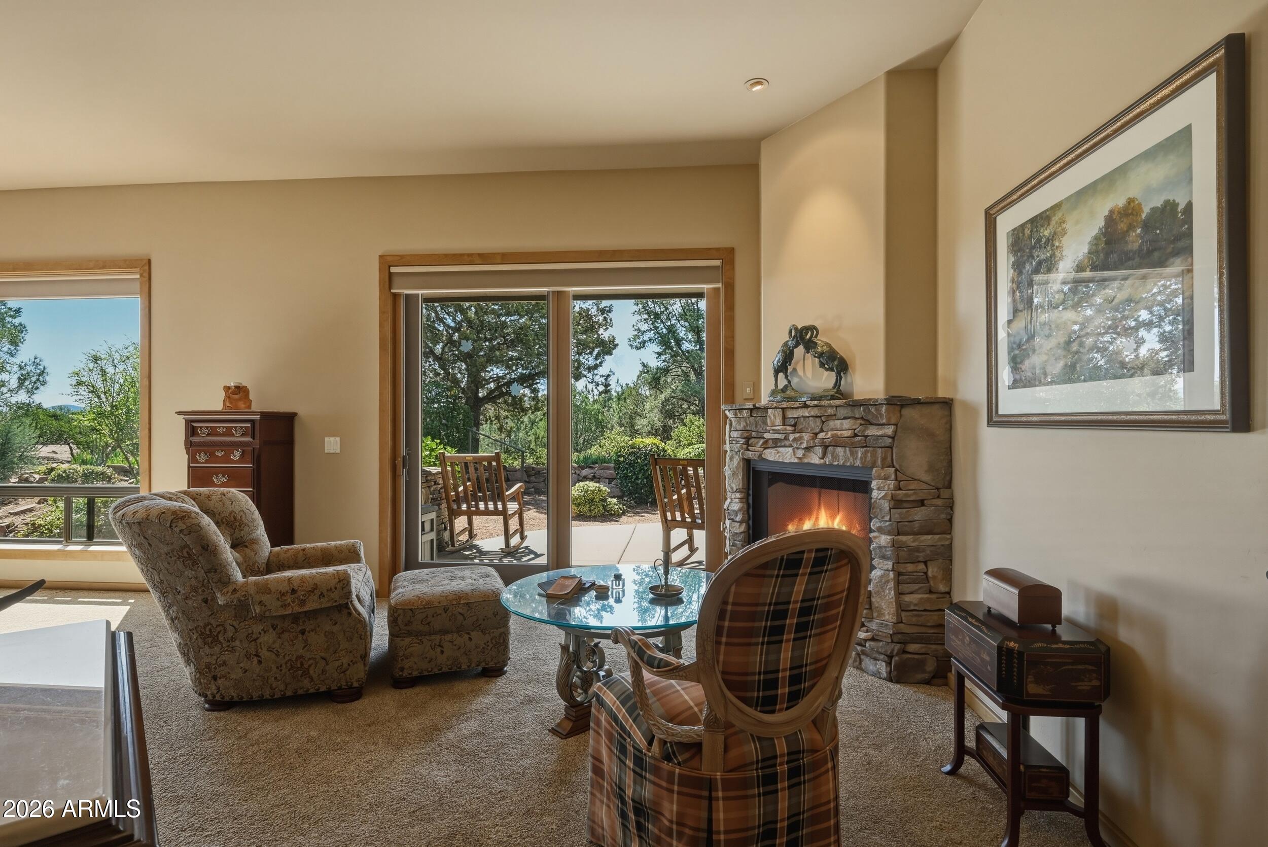3101 East Mayfield Payson, AZ 85541 - Photo 29 of 71 a living room with furniture a fireplace and a large window